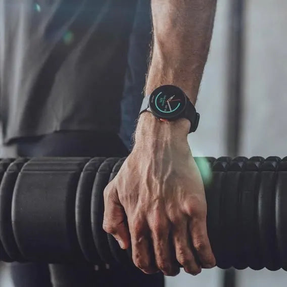 Man wearing a smartwatch displaying a workout timer during exercise session | Polar Philippines