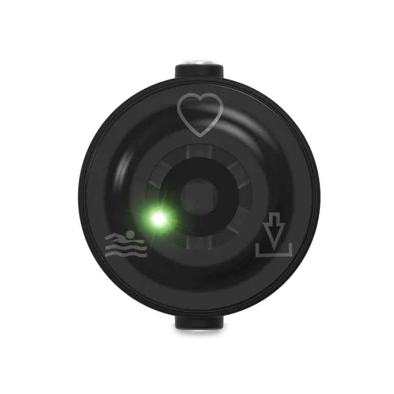 Rear view of a circular optical heart rate sensor displaying active internal lenses | Polar Philippines