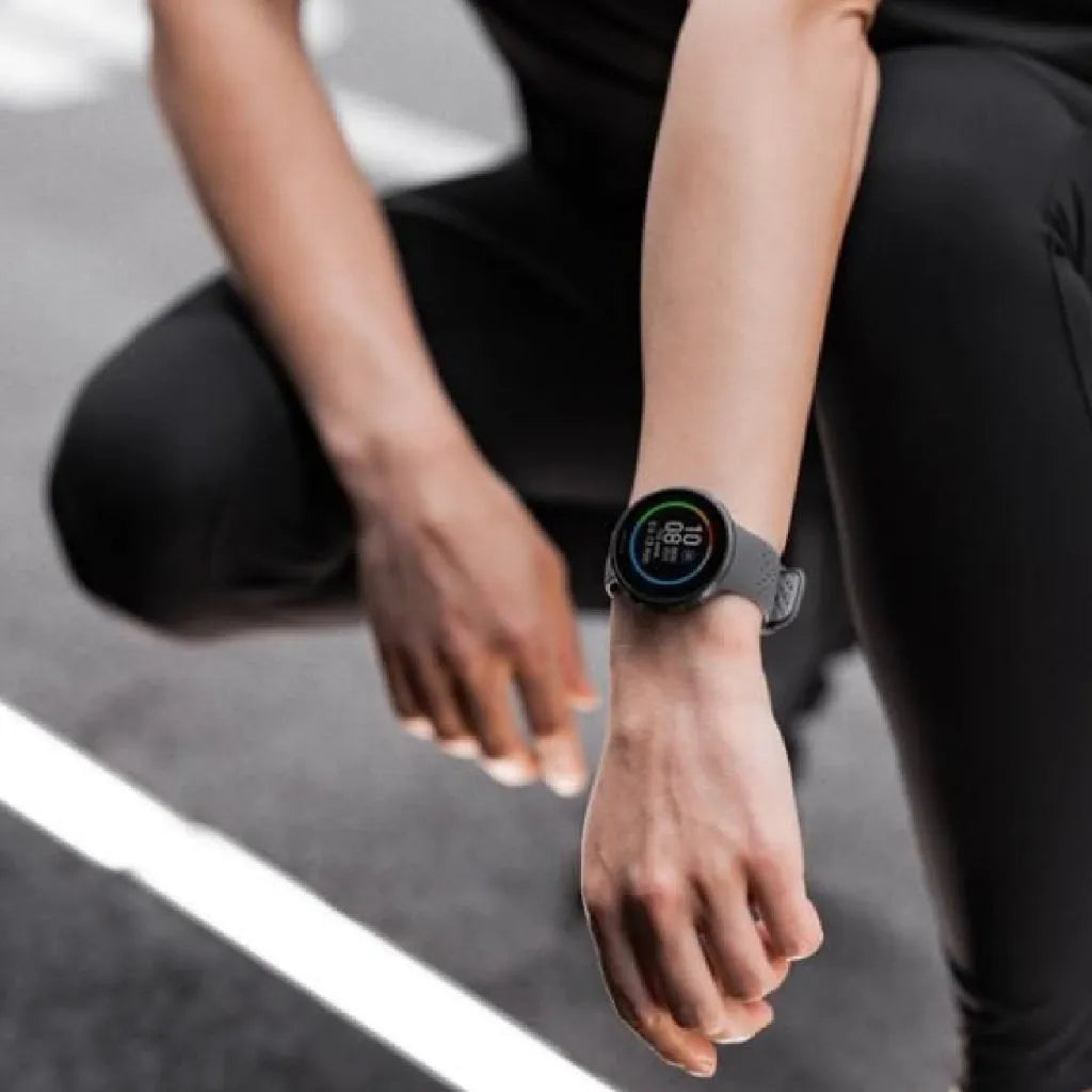 Person wearing smartwatch against blurred outdoor background | Polar Philippines