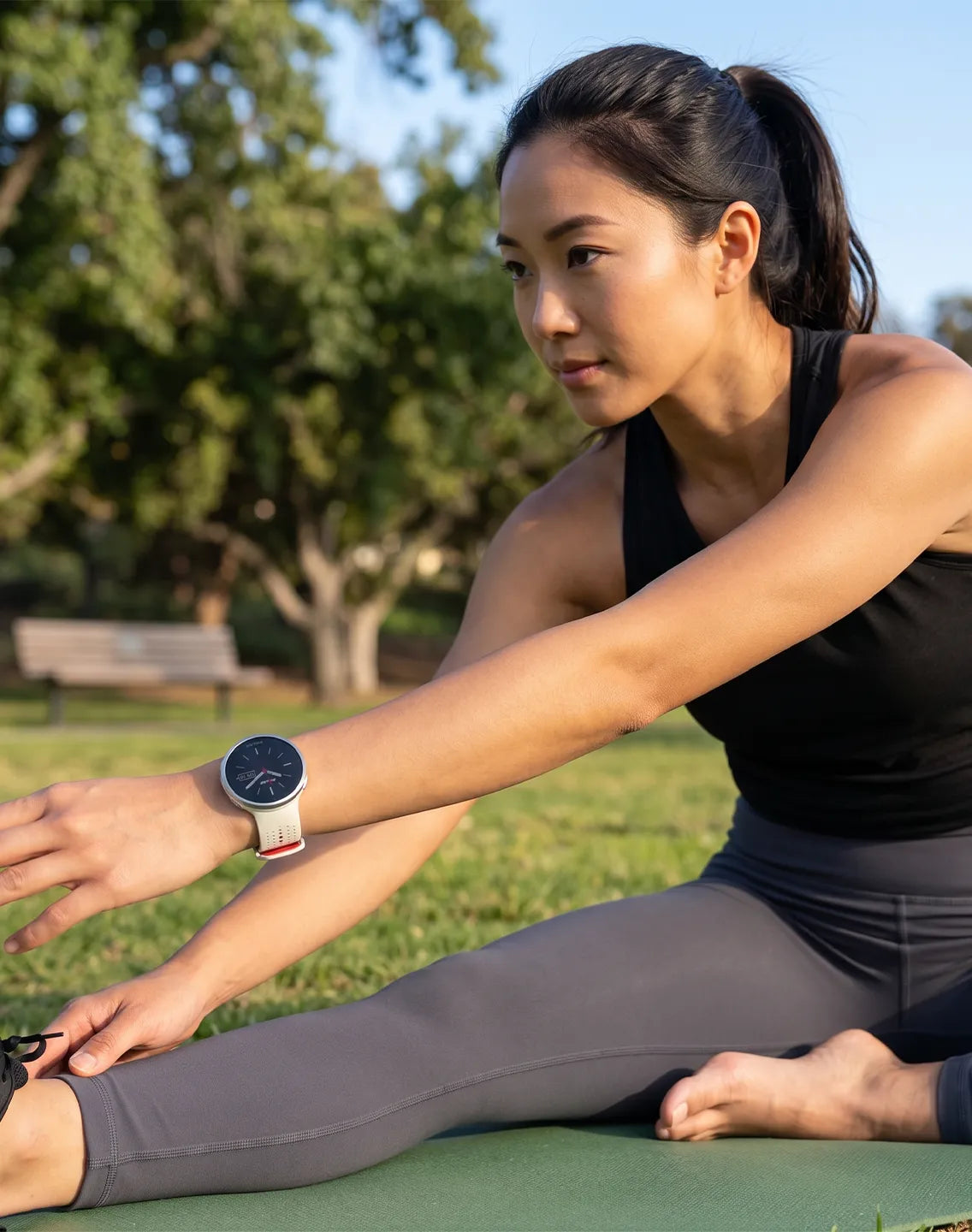 Woman wearing a smartwatch during an outdoor activity on a bright sunny day | Polar Philippines