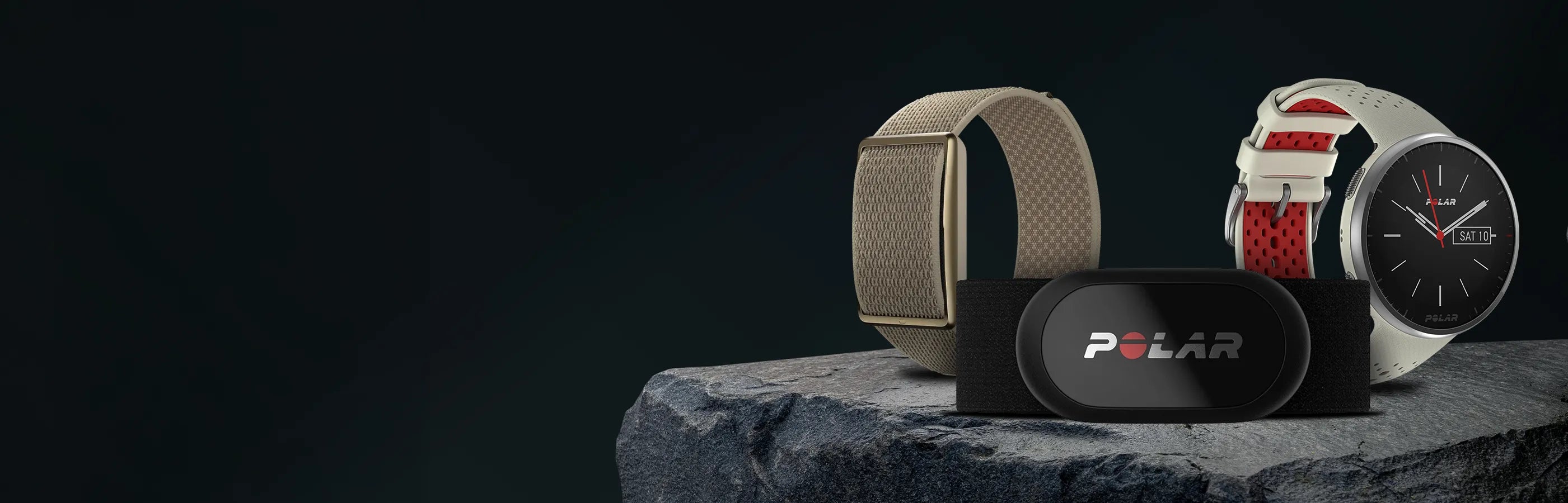Smartwatch with heart rate sensor display resting on rock with dark green backdrop | Polar Philippines