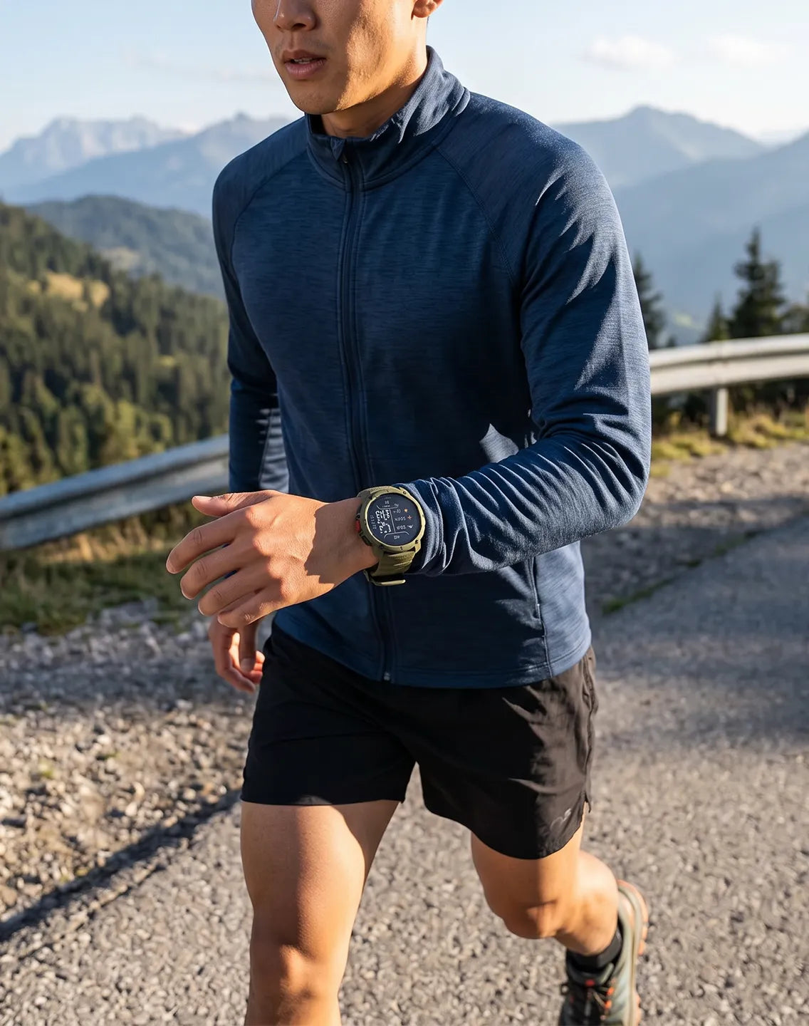 Man wearing a smartwatch while walking along a mountainside road on a sunny day | Polar Philippines