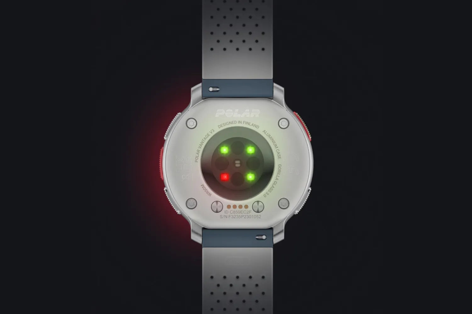 Rear view of Polar smartwatch with illuminated sensor lights on dark background | Polar Philippines