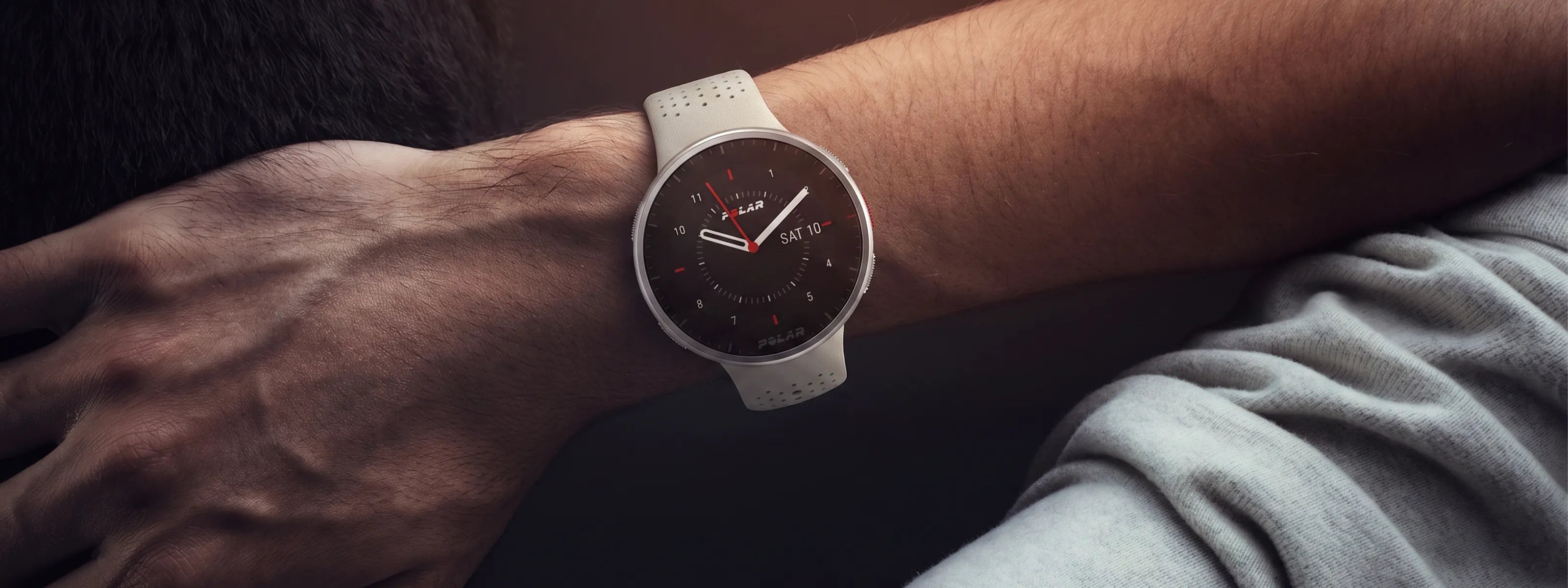 Close-up of a smartwatch with analog display on a resting wrist | Polar Philippines