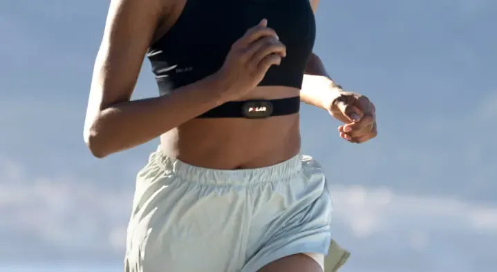 Female runner exercising with a wireless heart rate monitor chest strap | Polar Philippines