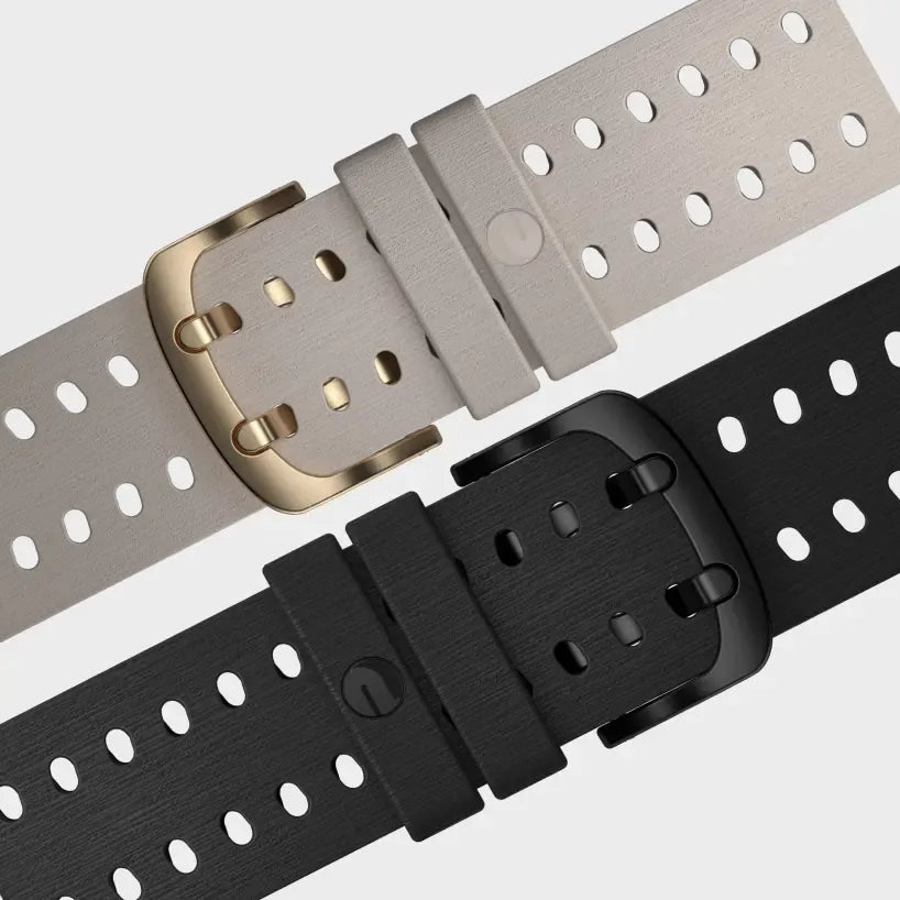 Dual-tone Polar watch straps with black and beige buckles on gray background | Polar Philippines