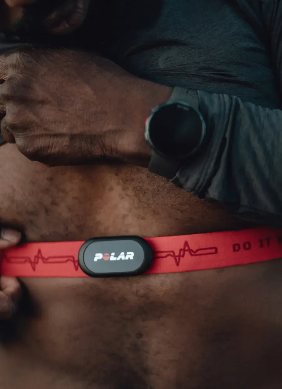 Athlete wearing a red heart rate monitor chest strap and smart watch | Polar Philippines