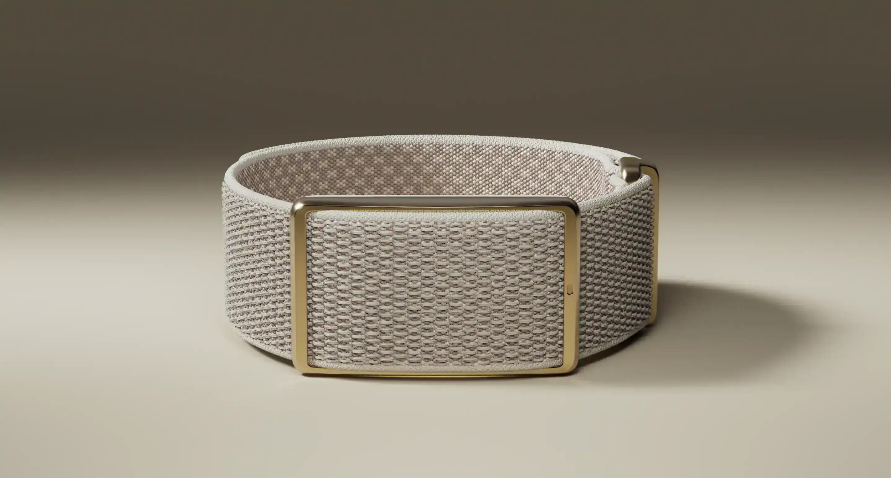 Screen-free health band and fitness tracker with gold buckle on beige backdrop | Polar Philippines
