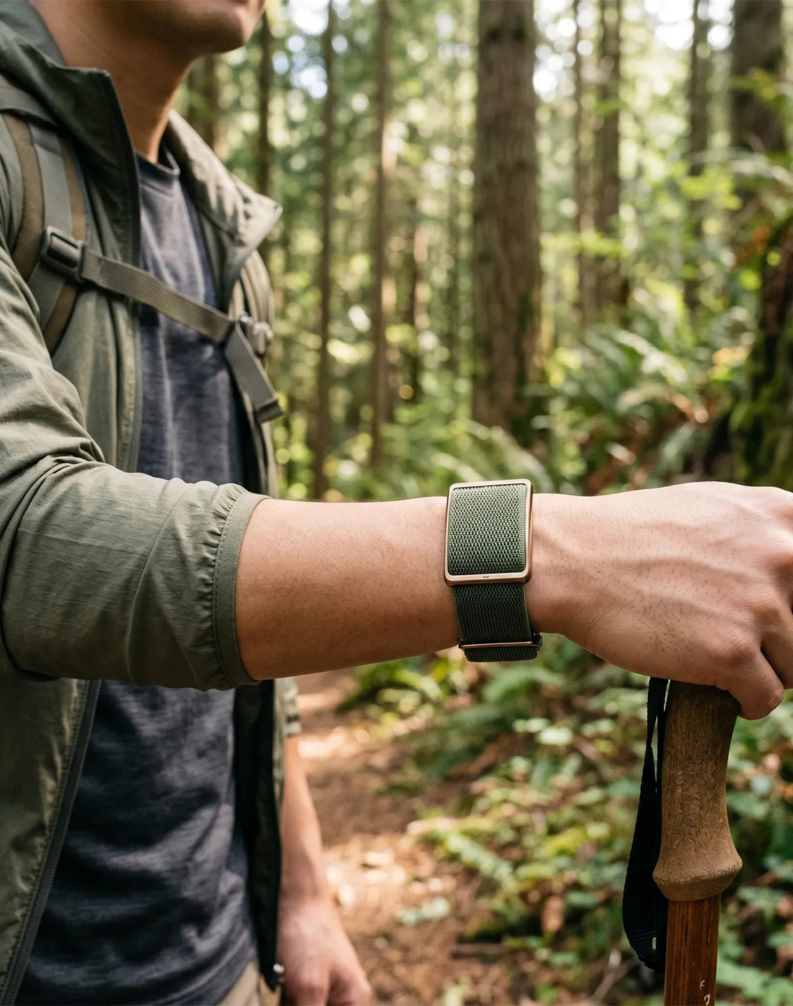 Man wearing a heart rate sensor while hiking through a forest trail outdoors | Polar Philippines