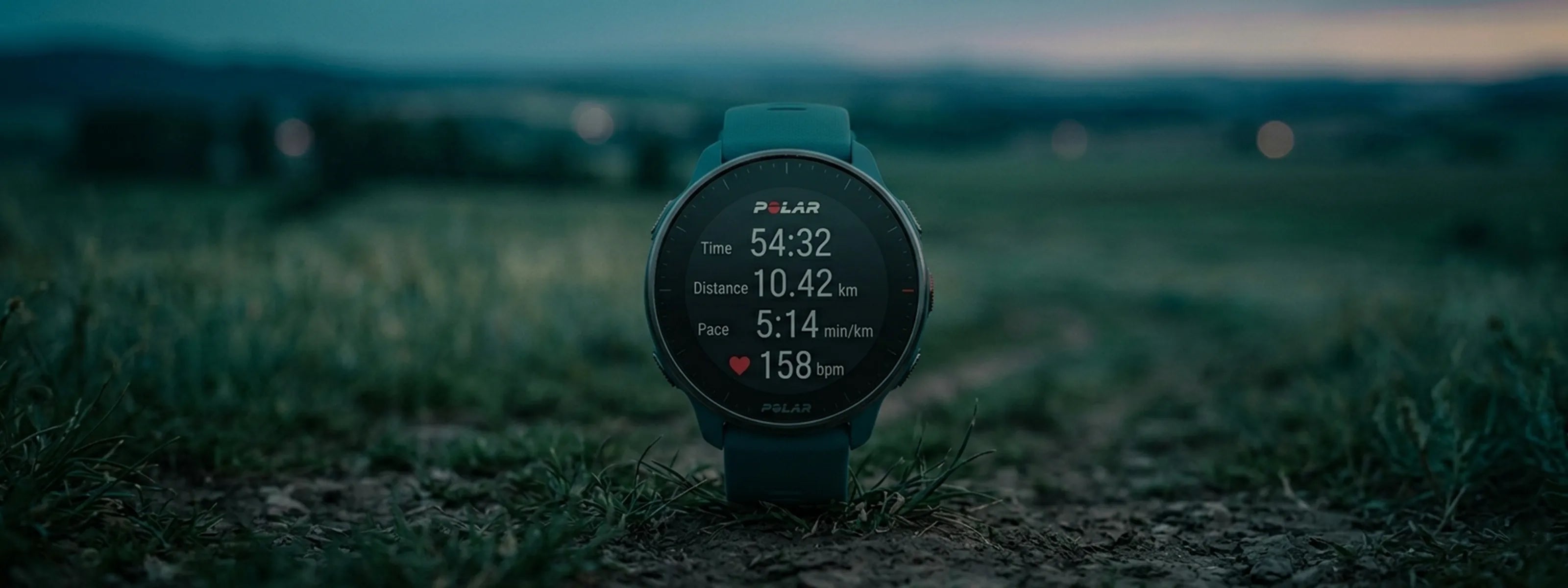 GPS sports watch displaying running stats in open field for outdoor training | Polar Philippines